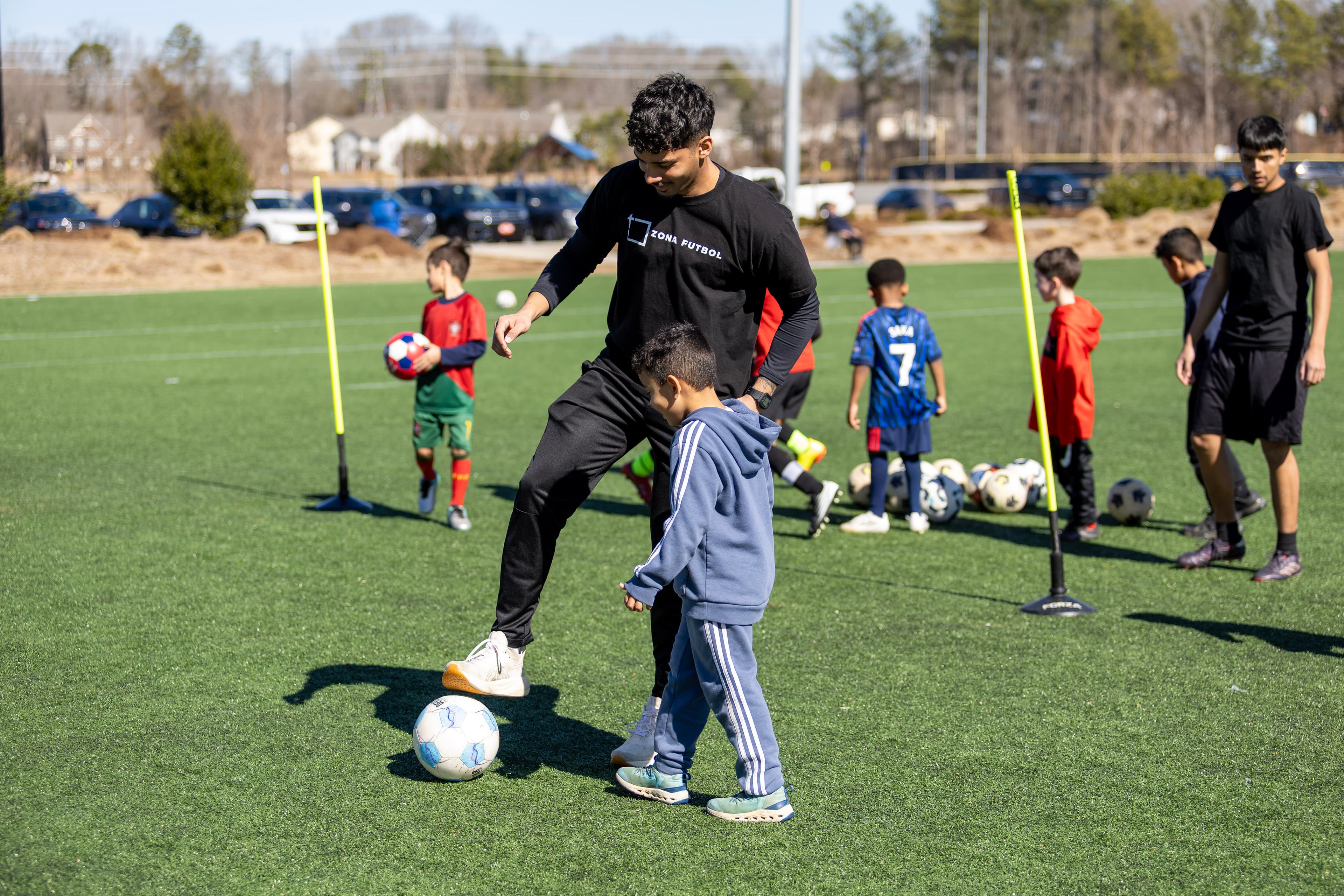 Zona Futbol coaches and players in training